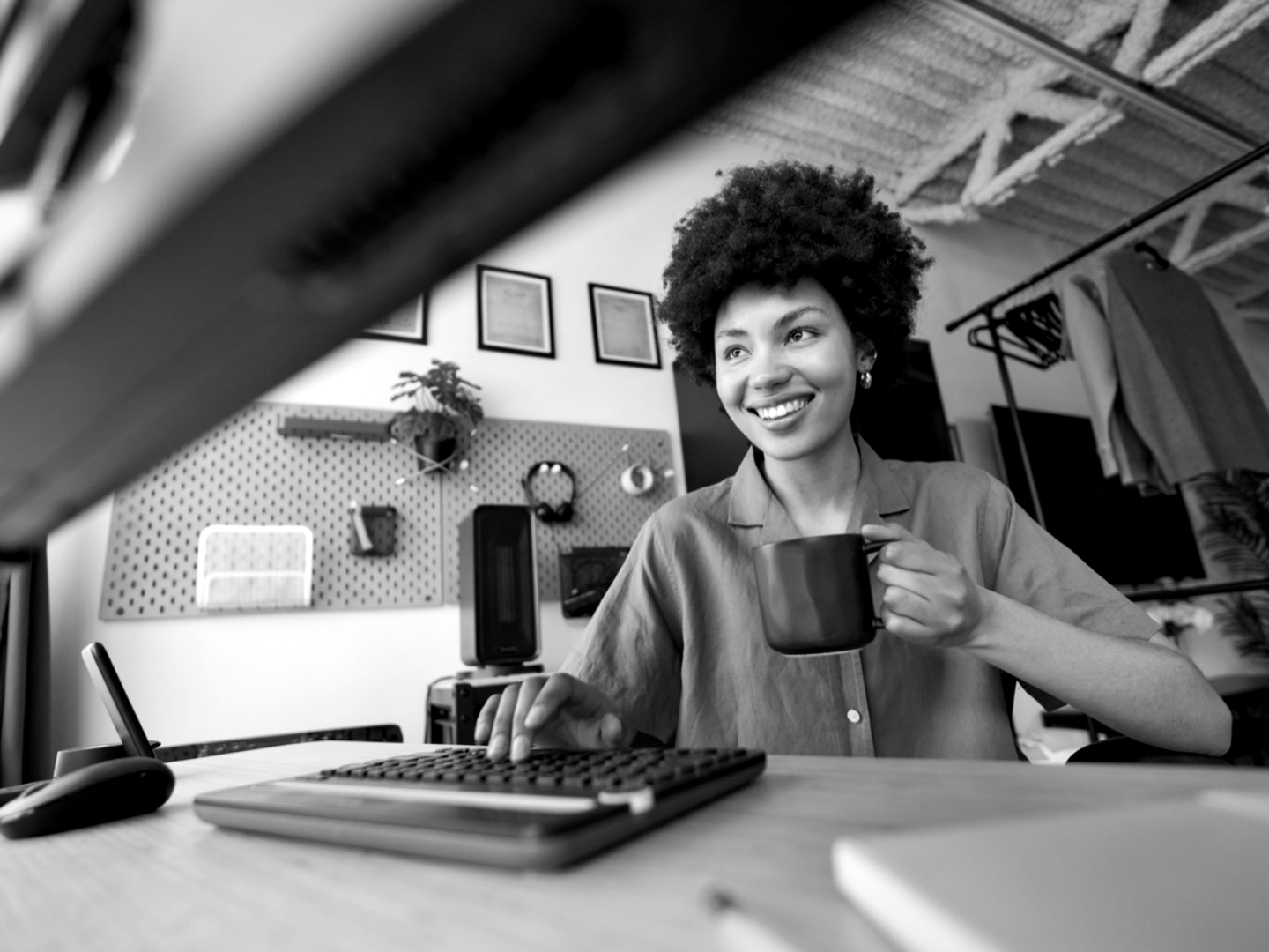 A home desk workspace in monochrome