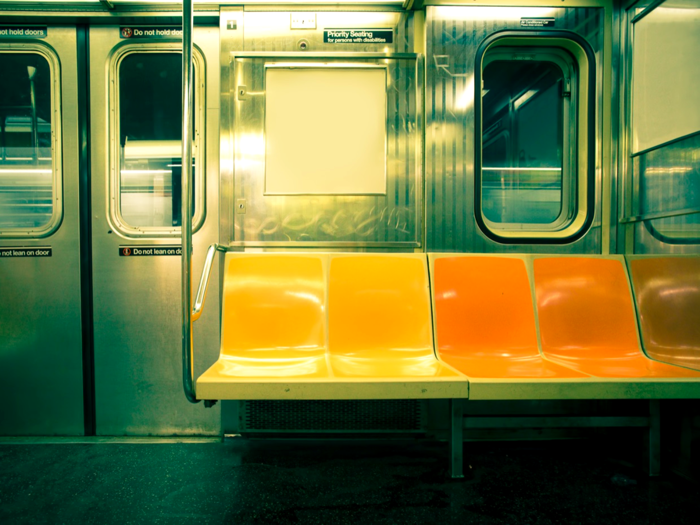 A city transit car interior with a warm color grade