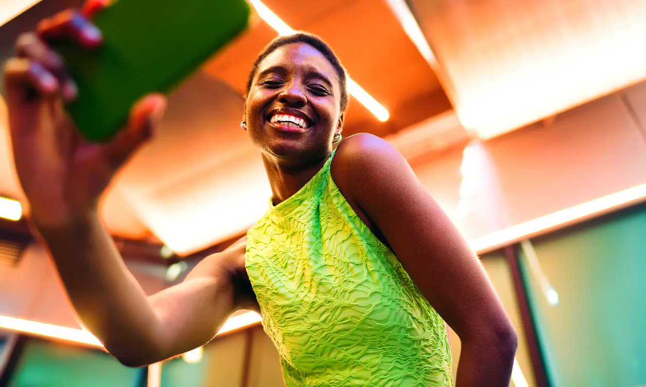 Creator filmed from three-quarter angle with vibrant, high saturation color grading