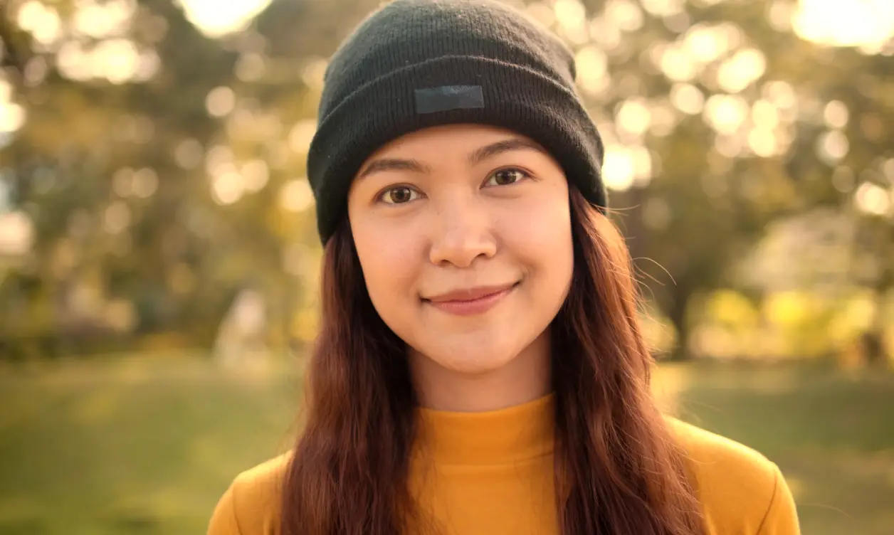 Creator filmed at eye level with warm, golden hour color grading