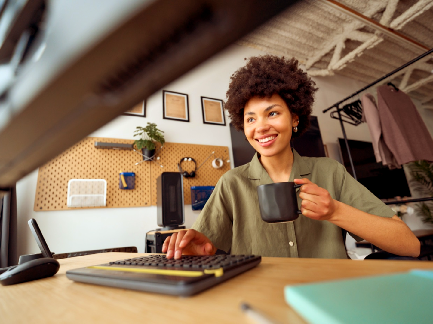 A home desk workspace with a warm color grade