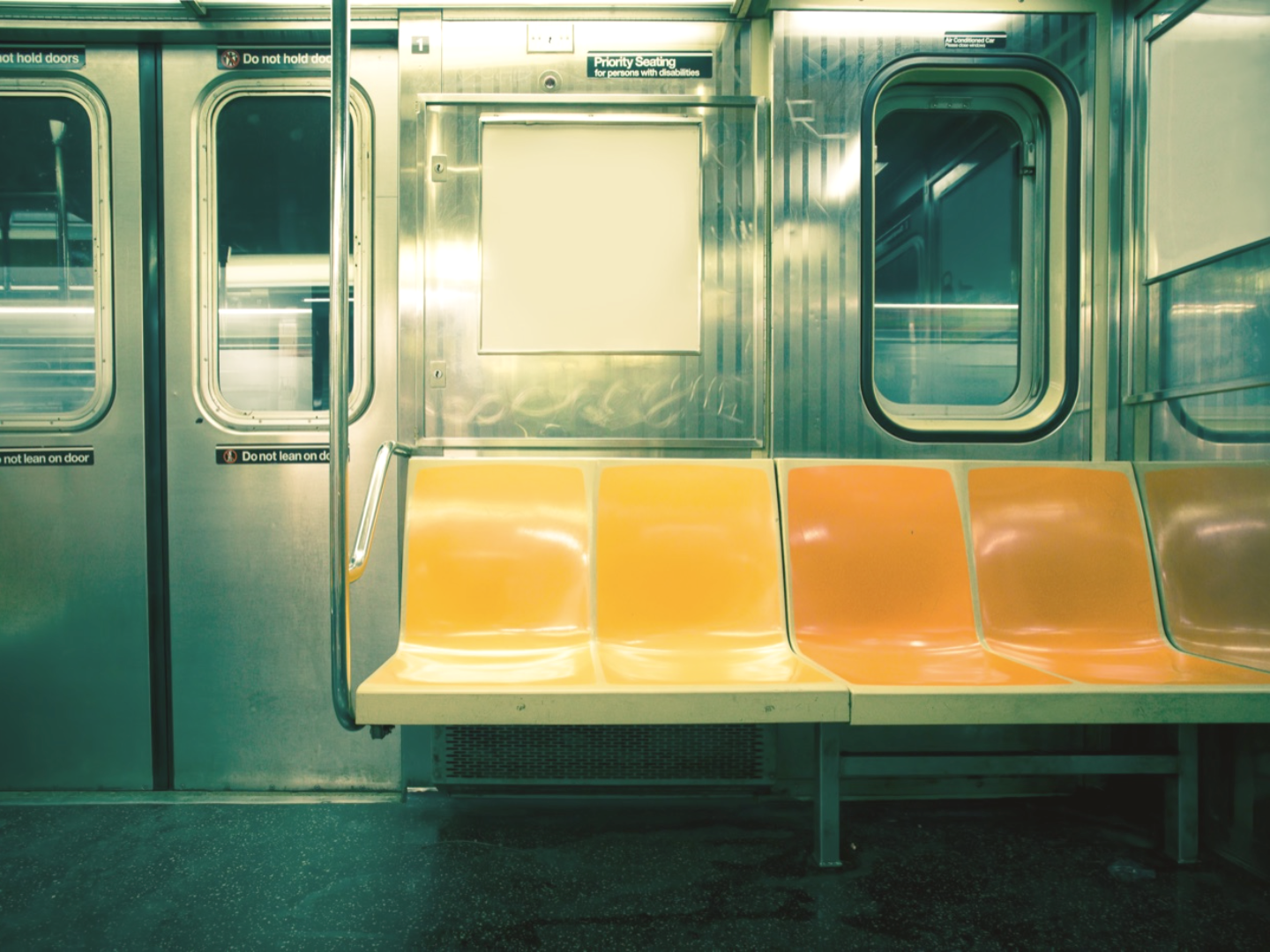 A city transit car interior with a faded color grade